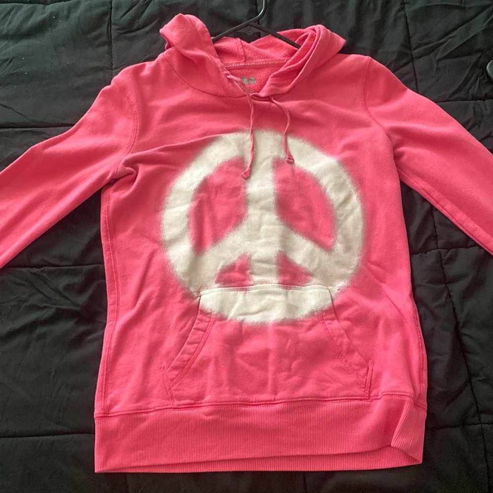 Worn peace sign sweatshirt. Says it is a medium, but it fits pretty small.